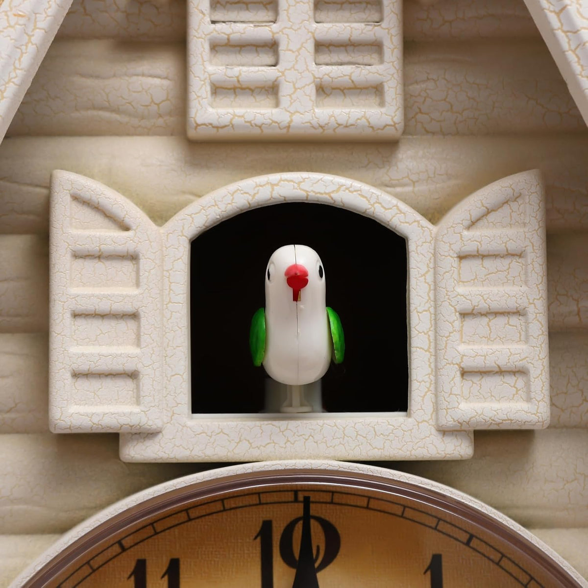 Horloge murale à coucou blanc crème, cygnes dorés au cadran