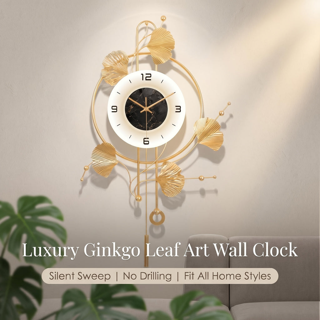 Horloge murale en fer doré à feuilles de ginkgo et balancier