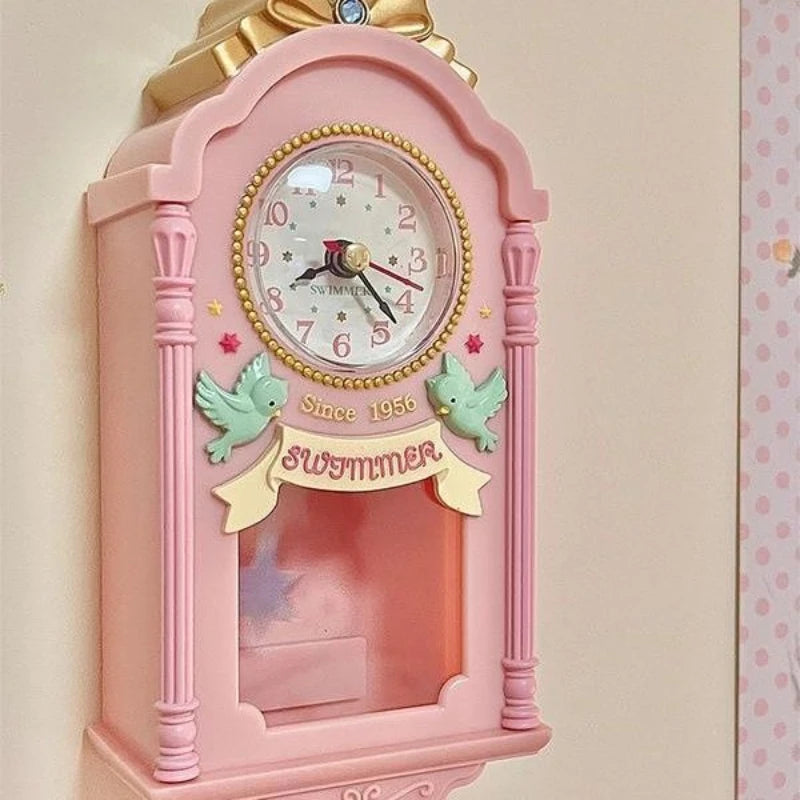 Horloge murale rose miniature 9 x 19 cm, décor d'oiseaux
