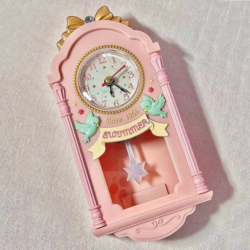 Horloge murale rose miniature 9 x 19 cm, décor d'oiseaux