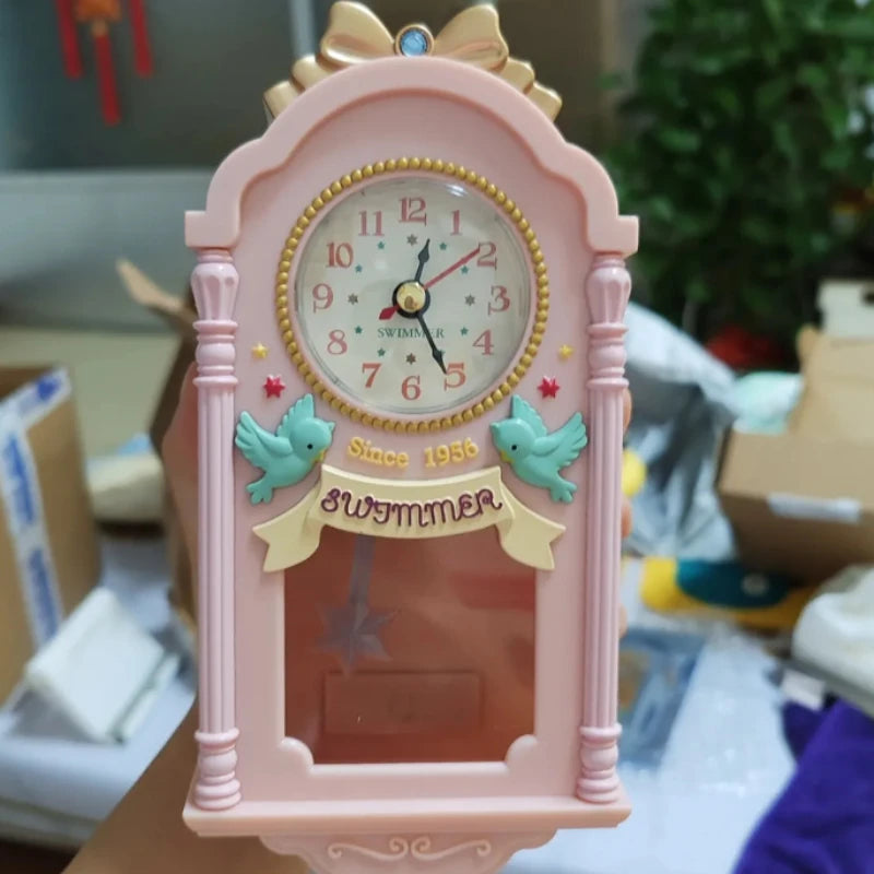 Horloge murale rose miniature 9 x 19 cm, décor d'oiseaux